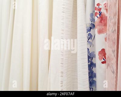 tulle fabric textile background. tulle samples, shop window. Polyester curtains in warehouse` Stock Photo